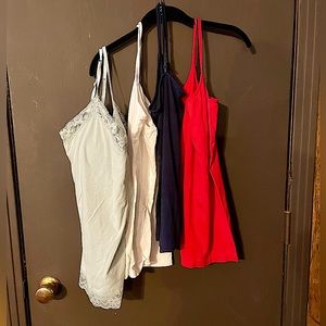 4 Spaghetti strap shirts. Size M/L